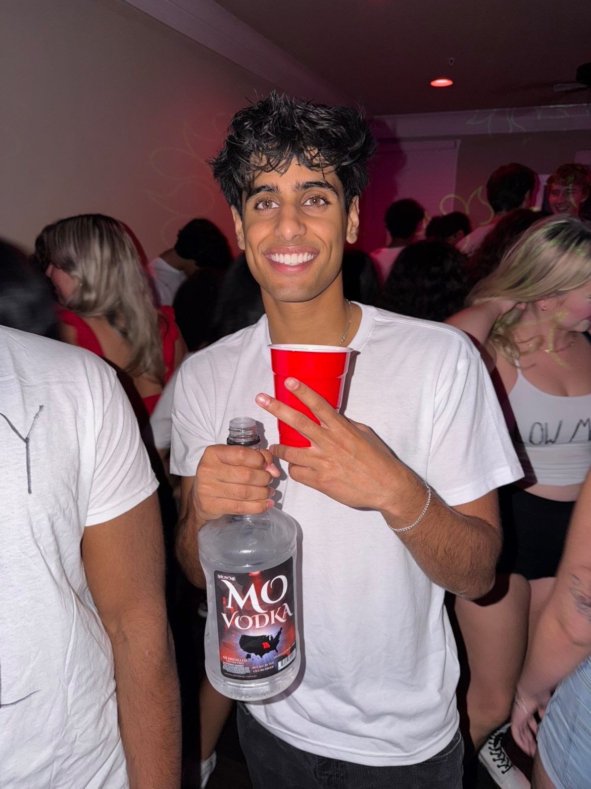 guy holding mo's vodka